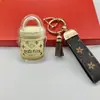 Colgante de llavero de lujo bañado en oro para comercio electrónico transfronterizo, regalo para la industria de la belleza, promoción de transmisiones en vivo y obsequios para clientes