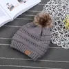 Gorro de lana para padres e hijos europeo y americano con pompón y forro de terciopelo, gorro de punto cálido, gorro de moda, venta al por mayor directa de fábrica