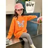 Camiseta de manga larga de algodón puro para niñas, nuevo estilo primavera y otoño, top casual holgado para niños mayores, elegante camiseta básica de cuello redondo para niñas