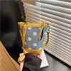 Bolsa Mini Balde de Design de Nicho Transfronteiriço com Bolinhas Verão 2026 Nova Bolsa de Armazenamento para o Dia a Dia Bolsa de Ombro Transversal