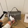 Bolso pequeño cuadrado de lunares de moda transfronterizo para mujer 2026 verano nuevo diseño de nicho bolso de mano de un solo hombro bolso cruzado para mujer