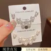 Exquisito y Moderno Set de Aretes de Tres Piezas con Lazo de Diamantes Completos y Perlas de Estilo Coreano con un Diseño Único y Sencillo