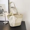 Bolso de Paja Tejida para Mujer Estilo Francés con Adorno de Encaje 2026 Nuevo Verano para Salir a la Playa Estilo Ins Bolso de Hombro Único Tipo Cubo