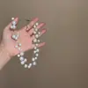 Elegante y estilizado collar de perlas estrelladas para mujer, nueva colección 2026, una cadena de clavícula popular y de alta gama, un collar ligero y versátil