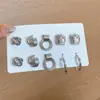 Pendientes plisados de flor redonda de metal de aguja plateada, de moda, sencillos, de lujo ligero, pendientes de alta gama, pendientes versátiles y exquisitos para mujer