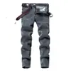 Venta al por mayor Jeans de Primavera y Otoño para Hombre Corte Slim Pierna Pequeña Pantalones Largos Grises Estilo Coreano Modernos Juveniles Elásticos Casuales