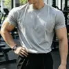 Venta de liquidación de temporada baja: Camiseta de manga corta de algodón puro de peso pesado, corte regular, cuello redondo, top atlético para hombre de verano y para todas las estaciones, diseñada para acentuar la figura