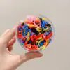 Banda elástica pequeña de ampliación directa de fábrica, joyería, anillo para el pelo desechable para niños en bolsa, venta al por mayor de accesorios para el cabello, cuerda para el pelo