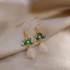 Pendientes de flor verde estilo nacional pendientes de lujo ligero de alta gama pendientes de estilo chino nuevo diseño de nicho pendientes antiguos de cheongsam