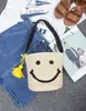 Bolso de paja tejida de planta pp para mujer coreana, bolso de barril tejido a mano con cara sonriente