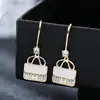 Bolsa simples estilo coreano brincos elegantes de nicho acessórios de joias personalizados brincos de cobre com incrustação de diamante geométrico em estoque para exportação