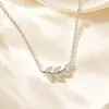 Conjunto de colar e pulseira de aço titânio com diamantes cor verde folha estilo floresta simples versátil aço inoxidável fabricante direto atacado de joias