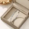 Pulsera Ovalada Clásica Más Vendida con Hebilla de Números Romanos para Mujer, Acero de Titanio, No se Desvanece, Pulsera Versátil, Joyería de Mano Finamente Pulida
