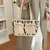 Bolso de hombro para mujer de gran capacidad, bolso tote casual para salidas, bolso de axila versátil con estampado de letras de moda, bolso de nicho y versátil