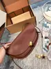 Bolsa de meia-lua atacado transfronteiriço novo modelo 2026 bolsa de bolinho de couro bovino macio bolsa de axila de couro genuíno da moda bolsa de ombro único transversal