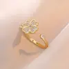 Collar para mujer estilo japonés y coreano transfronterizo copo de nieve mismo estilo micro-incrustado flor circonita conjunto giratorio traje collar de acero de titanio al por mayor