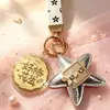 Regalos pequeños y prácticos para el Festival de Medio Otoño: campanilla de conejo rosa, moneda de la fortuna, llavero de pastel de luna, recuerdos promocionales corporativos