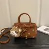 Bolso de mano de alta gama 2026 Nuevo Otoño/Invierno Meilade Gamuza Estampado de Leopardo Bolso Cuadrado Pequeño Diseño de Correa de Cuero Bolso Cruzado