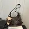 Bolsa Tote de Grande Capacidade 2026 Outono/Inverno Nova Elegante Versátil Nicho Casual Simples Bolsa de Ombro Conversível em Mochila Crossbody