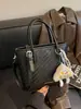 Bolso de mujer de nicho de alta gama transfronterizo 2026 nueva moda versión coreana bolso cruzado, bolso cubo de mano simple súper popular