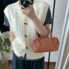 Senso de design coreano padrão tridimensional botão de alternância colete de tricô feminino novo outono cedo moda versátil colete suéter