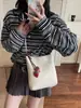Bolso Cubo Versátil de Alta Gama Transfronterizo para Mujer 2026 Nuevo Bolso de Hombro Cruzado de Gran Capacidad de Moda para el Trabajo y los Viajes Diarios