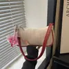 Bolso cuadrado pequeño de moda estilo dulce transfronterizo para mujer, nuevo bolso de hombro tejido de paja con bloques de color para el verano 2026, bolso de axila de moda