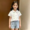 2026 Nuevo Verano Dibujos Animados Elegante Versátil Estampado Completo Corazón Manga Corta Camisa Polo Camiseta para Niños y Niñas