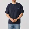 Ropa de Hombre Xintang 2026 Verano Nueva Camisa de Manga Corta Estilo Americano Camiseta de Punto a Cuadros con Cinta Bloque de Color para Hombre