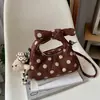 Bolsa tote pequena super quente transfronteiriça feminina 2026 nova outono inicial de mão nicho poá bolsa de ombro única para o trabalho bolsa transversal