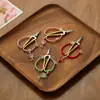 Tijeras de té retro estilo chino fabricadas en fábrica, tijeras individuales de aleación hechas a mano para cortar bolsitas de té, accesorios de té para el arte del té y la ceremonia del té