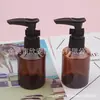 Frasco marrom de 50ml com bomba de clipe, frasco de ombro inclinado, frasco de bomba de loção de 50ml, frasco de refil para gel de banho, frasco de limpador facial