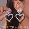 Pendientes de cadena de garra exagerada de estilo europeo y americano, con doble corazón de melocotón y diamantes de imitación, llenos de temperamento encantador para mujer.