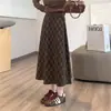 Saia plissada A-line pequena inglesa de temperamento elegante Cintura reta minimalista Saia longa xadrez com atmosfera de outono e inverno Meia-saia emagrecedora