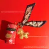 Beige Agua Oro Puro 999 Cilindro de Bendición Instantánea Llavero Colgante para Bolso de Pony Regalo Navideño para Novia Venta al por Mayor