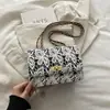Moda coreana Elegante de moda Bolso de un solo hombro Encaje de punto Personalidad Bolso de mujer 2026 Verano Nuevo Cadena simple Bolso cuadrado pequeño