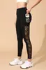 Pantalones de Yoga Transfronterizos Europeos y Americanos Nuevo Estilo Popular Pantalones Deportivos de Exterior de Nueve Puntos Leggings con Bolsillo de Malla Empalmado para Levantar Glúteos para Mujer