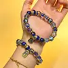 Nuevo brazalete y colgante de cristal de un solo bucle luminoso azul con ceniza de incienso y pan de oro original, suministro directo a templos y áreas escénicas, venta al por mayor