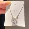 Collar de perlas con flor de trébol incrustada de circonita, cadena para la clavícula de lujo ligero de nicho de alta gama, accesorio de moda versátil y elegante