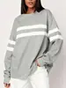 Top casual versátil para mujer de estilo europeo y americano para otoño, nuevo, color liso y bloques de color, a rayas, corte holgado, hombros caídos, cuello redondo, en stock