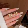 Pendientes de botón con forma de lazo totalmente engastados con diamantes, estilo coreano de lujo ligero, aguja de plata s925, exquisitos, temperamento de nicho, pendientes simples y versátiles, accesorios para la oreja