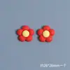 Una pequeña flor roja de cinco pétalos pegamento cremoso funda de teléfono móvil material diy accesorios de resina de celebridad de internet hechos a mano pegamento de goteo