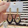 Brincos Europeus e Americanos Exagerados Longos com Esmalte de Gota Brinco de Agulha de Prata Elegante de Alta Qualidade Brincos de Moda Novos 2023