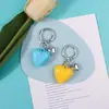 Nuevo llavero decorativo multicolor de resina con forma de corazón para llaves de coche, versátil y creativo.
