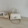Elegante bolso pequeño cuadrado de mano para mujer, nuevo modelo 2026, bolso de cadena acolchado estilo Chanel, bolso de hombro y cruzado moderno y versátil