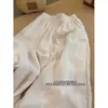 Calça casual de renda bordada off-white para mulheres, novo design de verão 2026, estilo de alta qualidade, calça fina solta de perna larga