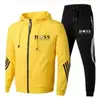 Suéter deportivo informal de dos piezas para hombre, sudadera con capucha estampada, disponible en stock.