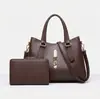Bolso de mano de bajo perfil de alta gama para madre e hija, tendencia europea y americana 2026, para ir al trabajo y viajar, bolso bandolera versátil, suministro del fabricante