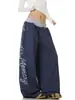 Pantalones casuales de retazos con estampado de letras desgastado estilo retro americano, unisex streetwear holgados de pierna ancha con pierna curva