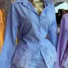Ropa de mujer transfronteriza europea y americana 2026 otoño nuevo conjunto casual de camisa a rayas con encaje empalmado y pantalones cortos de pierna ancha de cintura alta